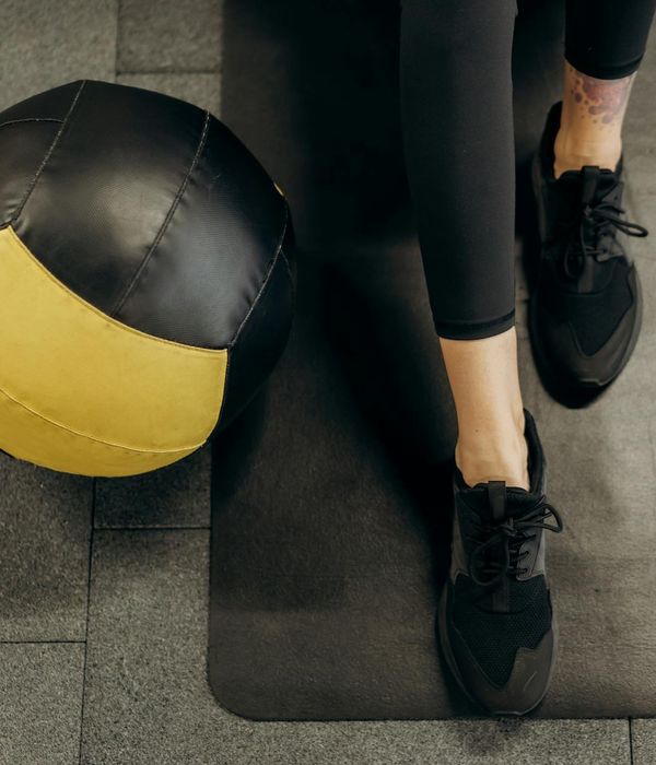 Athlete showing flexibility and power during a workout session.